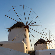 Amazing Sunset and White windmills on the island of Mykonos, Cyclades, Greece