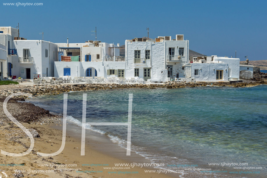 Old white house and Bay in Naoussa town, Paros island, Cyclades, Greece