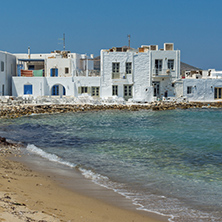 Old white house and Bay in Naoussa town, Paros island, Cyclades, Greece
