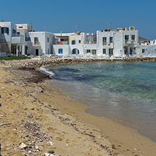 Old white house and Bay in Naoussa town, Paros island, Cyclades, Greece