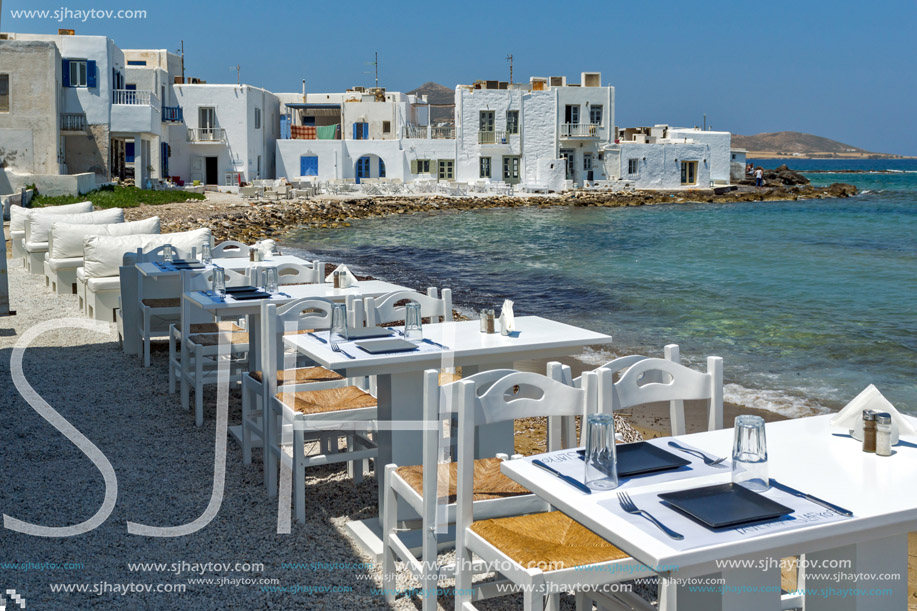 Old white house and Bay in Naoussa town, Paros island, Cyclades, Greece