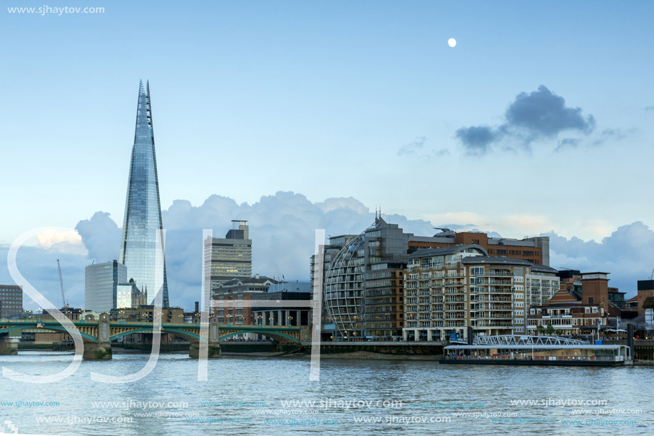 LONDON, ENGLAND - JUNE 17 2016: Twilight on the Thames river and The Shard, London, Great Britain