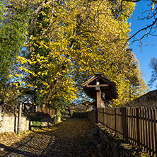 BOZHENTSI, BULGARIA - OCTOBER 29 2016:   Street with autumn trees in village of Bozhentsi, Gabrovo region, Bulgaria