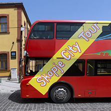 SKOPJE, REPUBLIC OF MACEDONIA - 13 MAY 2017:  A red double-decker bus passing through the streets of city of Skopje, Republic of Macedonia