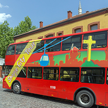 SKOPJE, REPUBLIC OF MACEDONIA - 13 MAY 2017:  A red double-decker bus passing through the streets of city of Skopje, Republic of Macedonia