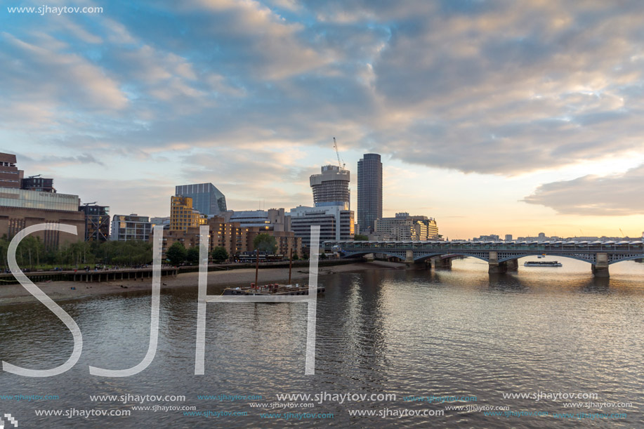 LONDON, ENGLAND - JUNE 18, 2016: Amazing sunset Cityscape from Millennium Bridge and Thames River, London, Great Britain