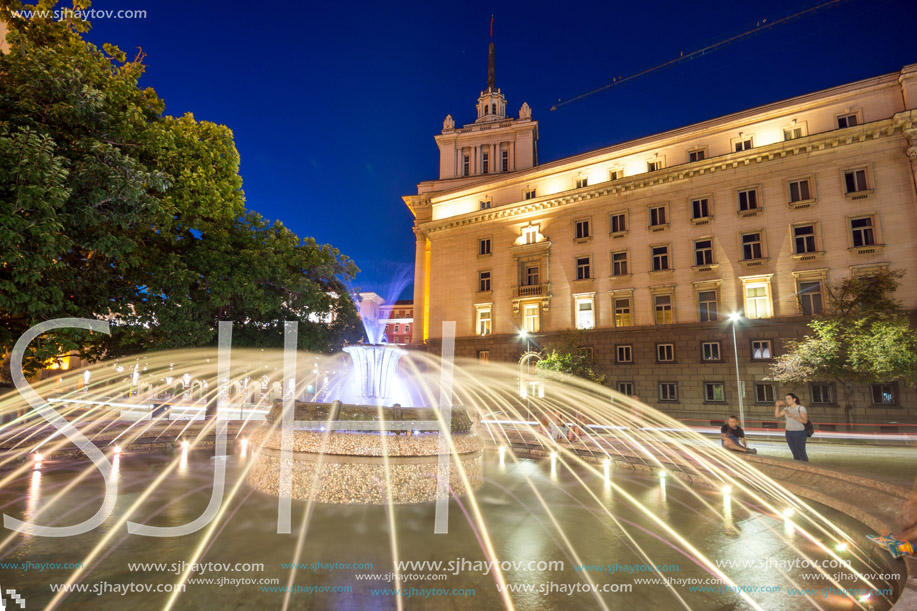 SOFIA, BULGARIA - JULY 21, 2017: Night photo of Fountain in front of The Building of the Presidency and Former Communist Party House in Sofia, Bulgaria
