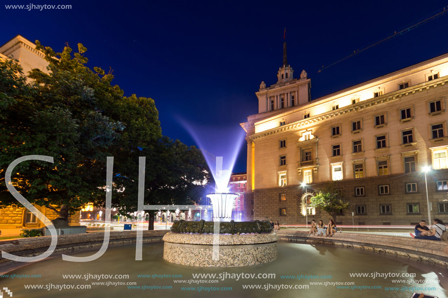 SOFIA, BULGARIA - JULY 21, 2017: Night photo of Fountain in front of The Building of the Presidency and Former Communist Party House in Sofia, Bulgaria