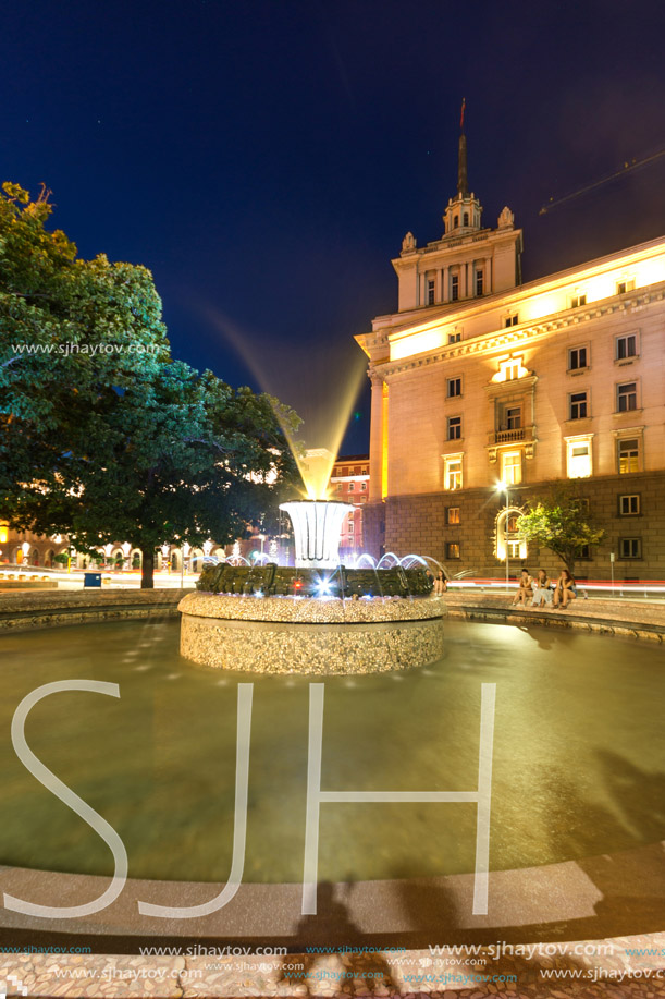 SOFIA, BULGARIA - JULY 21, 2017: Night photo of Fountain in front of The Building of the Presidency and Former Communist Party House in Sofia, Bulgaria