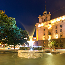 SOFIA, BULGARIA - JULY 21, 2017: Night photo of Fountain in front of The Building of the Presidency and Former Communist Party House in Sofia, Bulgaria