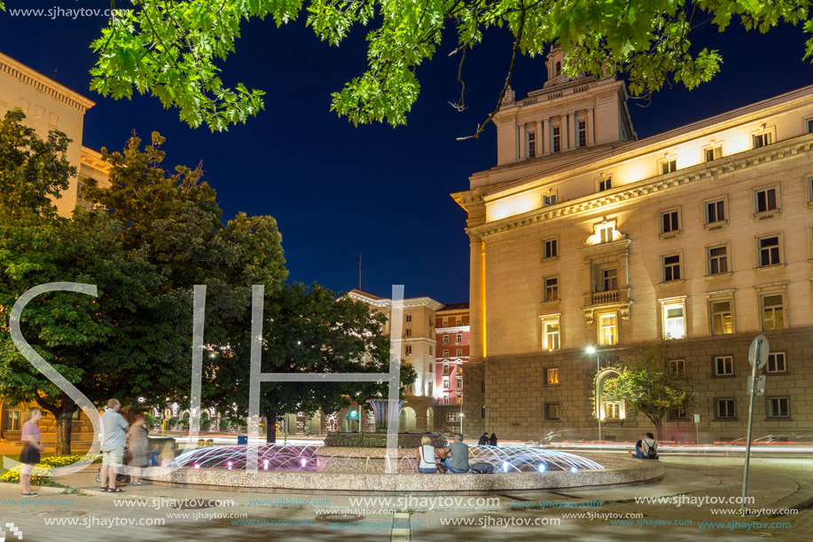 SOFIA, BULGARIA - JULY 21, 2017: Night photo of Fountain in front of The Building of the Presidency and Former Communist Party House in Sofia, Bulgaria