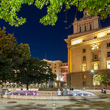 SOFIA, BULGARIA - JULY 21, 2017: Night photo of Fountain in front of The Building of the Presidency and Former Communist Party House in Sofia, Bulgaria