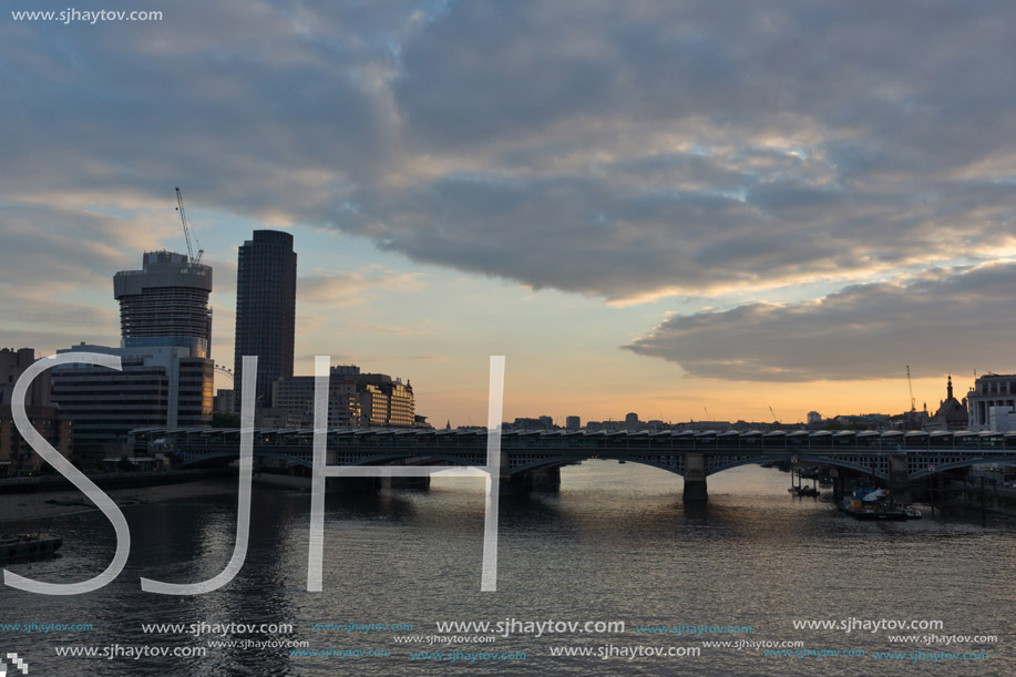 LONDON, ENGLAND - JUNE 18, 2016: Amazing sunset Cityscape from Millennium Bridge and Thames River, London, Great Britain