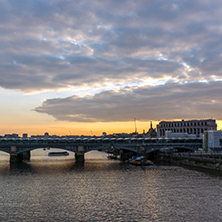 LONDON, ENGLAND - JUNE 18, 2016: Amazing sunset Cityscape from Millennium Bridge and Thames River, London, Great Britain