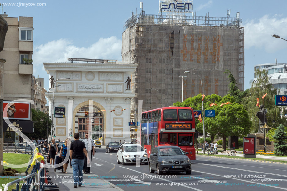 SKOPJE, REPUBLIC OF MACEDONIA - MAY  13, 2017:  A red double-decker bus passing through the streets of city of Skopje, Republic of Macedonia