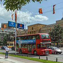 SKOPJE, REPUBLIC OF MACEDONIA - MAY  13, 2017:  A red double-decker bus passing through the streets of city of Skopje, Republic of Macedonia