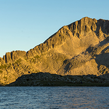 Sunset landscape with Kamenitsa peak and Tevno lake, Pirin Mountain, Bulgaria