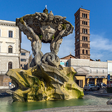 ROME, ITALY - JUNE 22, 2017:  Amazing view of Church of Santa Maria in Cosmedin and Fountain of the Tritons in city of Rome, Italy