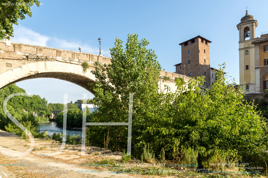 ROME, ITALY - JUNE 22, 2017: Amazing view of Castello Caetani, Tiber River and Pons Fabricius in city of Rome, Italy