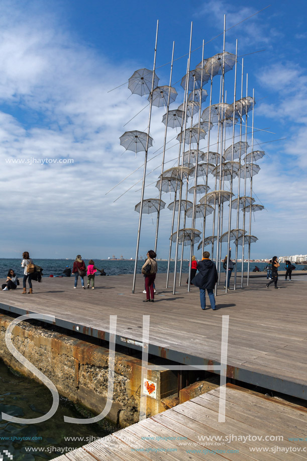 THESSALONIKI, GREECE - SEPTEMBER 30, 2017: People under Umbrellas sculpture in of of city of Thessaloniki, Central Macedonia, Greece
