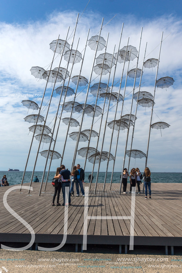THESSALONIKI, GREECE - SEPTEMBER 30, 2017: People under Umbrellas sculpture in of of city of Thessaloniki, Central Macedonia, Greece