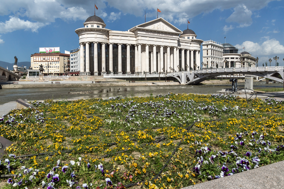 SKOPJE, REPUBLIC OF MACEDONIA - 13 MAY 2017: Skopje City Center - Archaeological Museum and Bridge over Vardar River, Republic of Macedonia