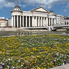 SKOPJE, REPUBLIC OF MACEDONIA - 13 MAY 2017: Skopje City Center - Archaeological Museum and Bridge over Vardar River, Republic of Macedonia