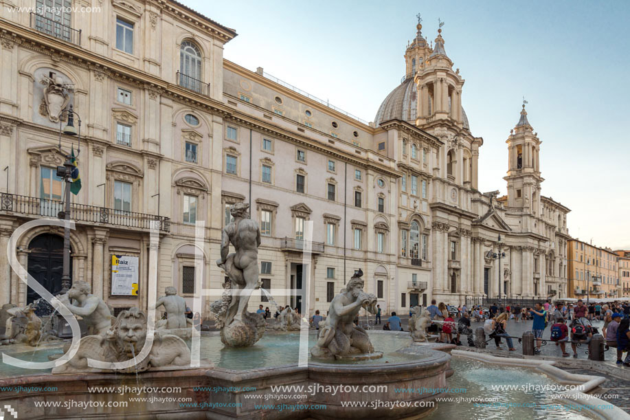 ROME, ITALY - JUNE 22, 2017: Tourists are strolling at the sunset in a Piazza Navona in city of Rome, Italy