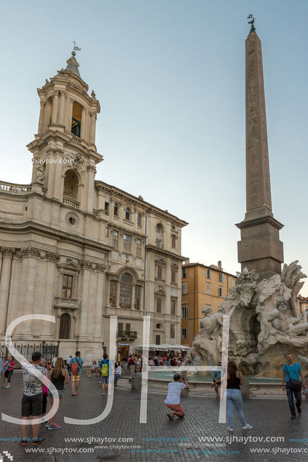 ROME, ITALY - JUNE 22, 2017: Tourists are strolling at the sunset in a Piazza Navona in city of Rome, Italy