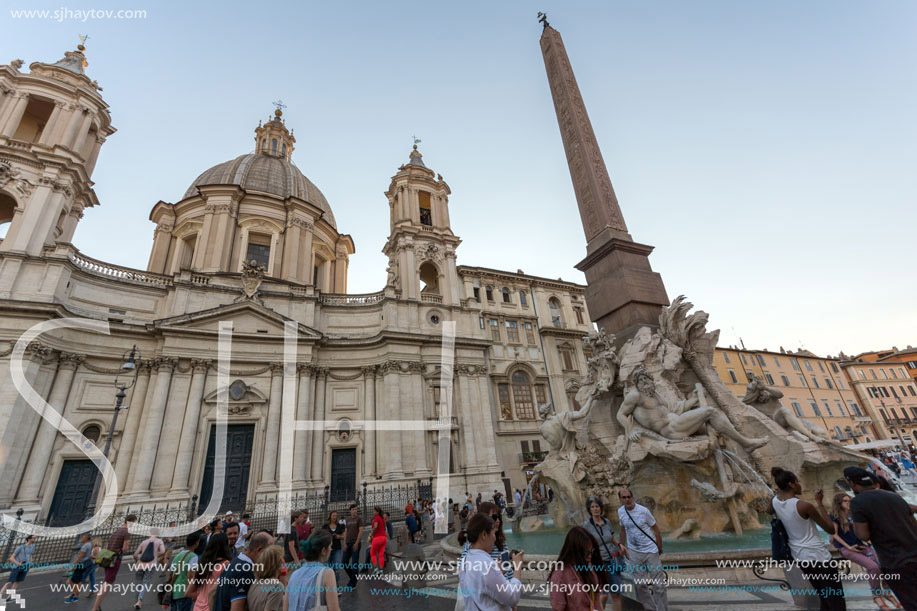 ROME, ITALY - JUNE 22, 2017: Tourists are strolling at the sunset in a Piazza Navona in city of Rome, Italy