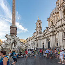 ROME, ITALY - JUNE 22, 2017: Tourists are strolling at the sunset in a Piazza Navona in city of Rome, Italy