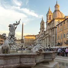 ROME, ITALY - JUNE 22, 2017: Tourists are strolling at the sunset in a Piazza Navona in city of Rome, Italy