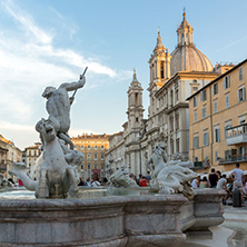 ROME, ITALY - JUNE 22, 2017: Tourists are strolling at the sunset in a Piazza Navona in city of Rome, Italy