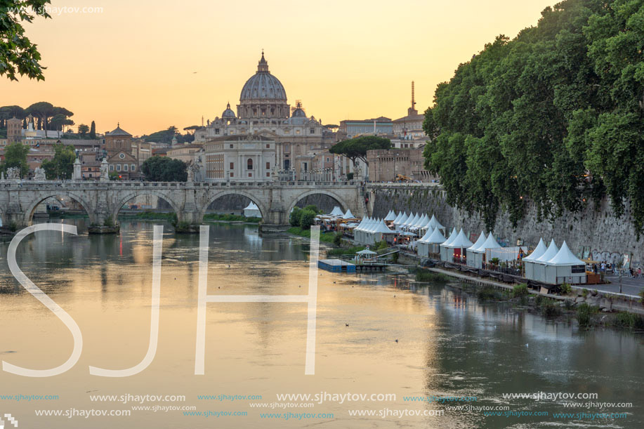 ROME, ITALY - JUNE 22, 2017: Amazing Sunset view of Tiber River, St. Angelo Bridge and St. Peter"s Basilica in Rome, Italy