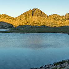 Amazing red Sunset landscape of Tevno lake, Pirin Mountain, Bulgaria