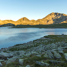 Amazing red Sunset landscape of Tevno lake, Pirin Mountain, Bulgaria