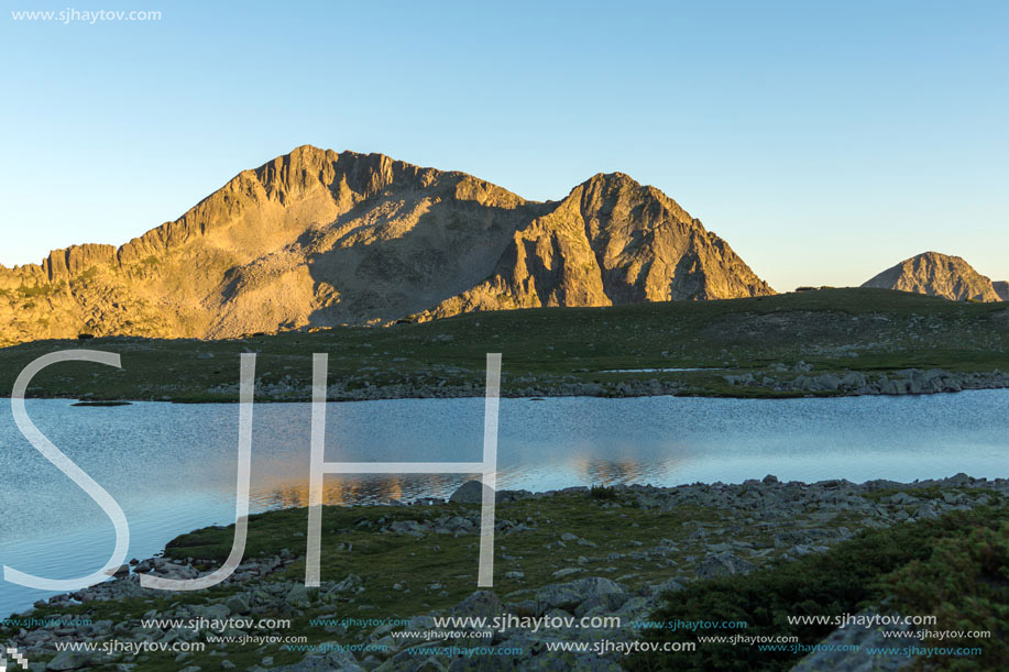 Amazing red Sunset landscape of Tevno lake, Pirin Mountain, Bulgaria