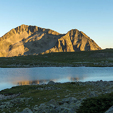 Amazing red Sunset landscape of Tevno lake, Pirin Mountain, Bulgaria