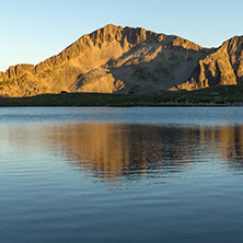 Amazing red Sunset landscape of Tevno lake, Pirin Mountain, Bulgaria