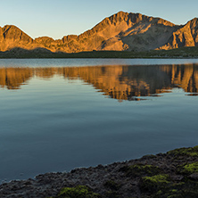 Amazing red Sunset landscape of Tevno lake, Pirin Mountain, Bulgaria