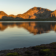 Amazing red Sunset landscape of Tevno lake, Pirin Mountain, Bulgaria