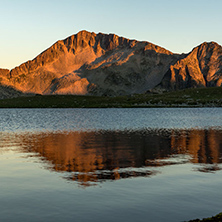 Amazing red Sunset landscape of Tevno lake, Pirin Mountain, Bulgaria