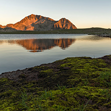 Amazing red Sunset landscape of Tevno lake, Pirin Mountain, Bulgaria