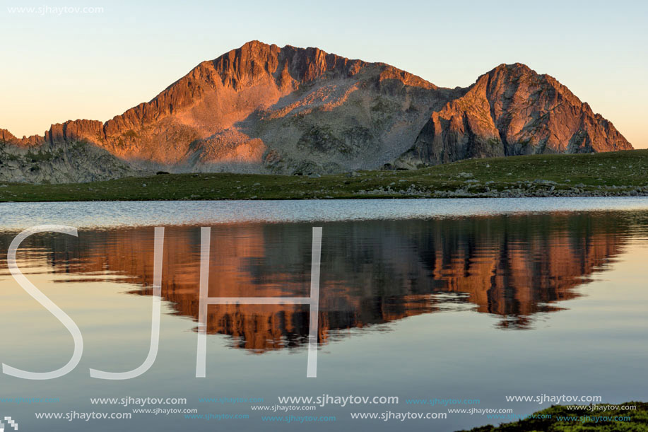 Amazing red Sunset landscape of Tevno lake, Pirin Mountain, Bulgaria