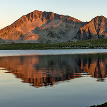 Amazing red Sunset landscape of Tevno lake, Pirin Mountain, Bulgaria