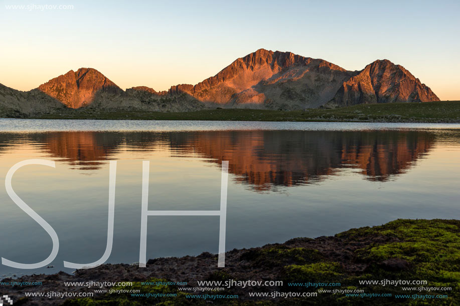 Amazing red Sunset landscape of Tevno lake, Pirin Mountain, Bulgaria