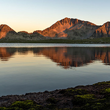 Amazing red Sunset landscape of Tevno lake, Pirin Mountain, Bulgaria