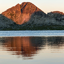 Amazing red Sunset landscape of Tevno lake, Pirin Mountain, Bulgaria