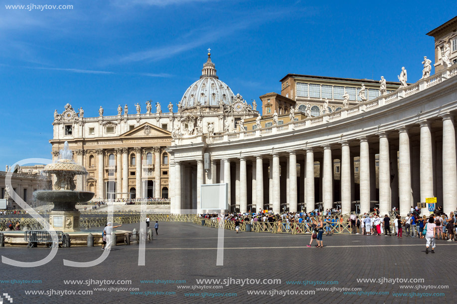 ROME, ITALY - JUNE 23, 2017: Tourists visit Saint Peter"s Square and St. Peter"s Basilica in Rome, Vatican, Italy