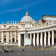 ROME, ITALY - JUNE 23, 2017: Tourists visit Saint Peter"s Square and St. Peter"s Basilica in Rome, Vatican, Italy